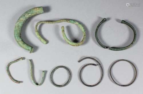 A Roman bronze or copper alloy bracelet, 2.75ins x 2.25ins (in two pieces), and eight other