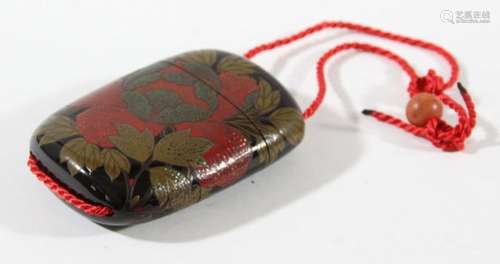 JAPANESE BLACK LACQUER THREE SECTION INRO, decorated with chrysanthemum in red lacquer, gilt and