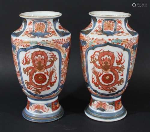 PAIR OF JAPANESE IMARI VASES, late 19th century, of baluster form with panels of dragons, height