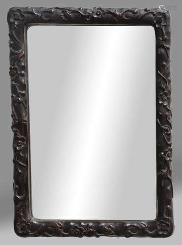 CHINESE RECTANGULAR HARDWOOD FRAME, carved with flowering prunus, currently fitted with a mirror,