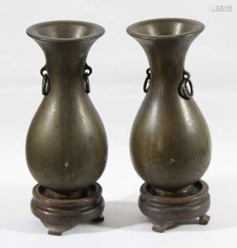 PAIR OF BRONZE AND YELLOW METAL INLAID VASES, late 19th century, of baluster form decorated with