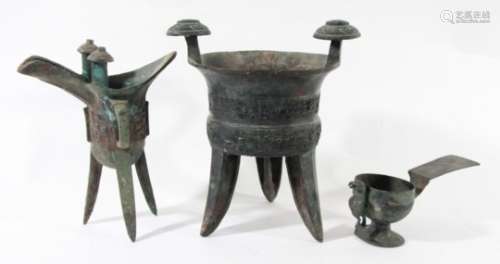 CHINESE BRONZE RITUAL VESSEL, jia, with scrolling decoration, on three legs, height 23cm; another,
