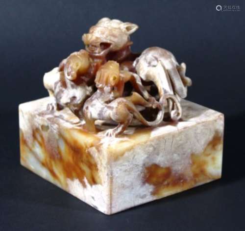 LARGE CHINESE SOAPSTONE SEAL, carved with a chilong and two young, 10cm square and high