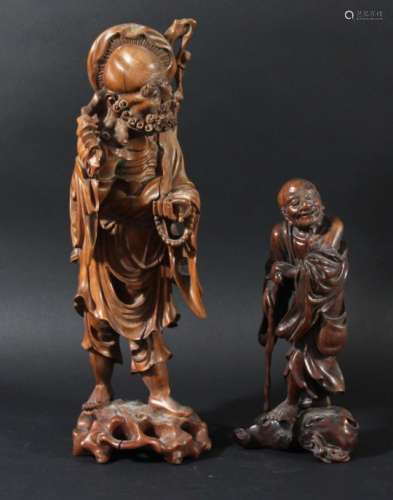 CHINESE ROOTWOOD CARVING, of a traveller holding his hat hooked on his staff over his shoulder,
