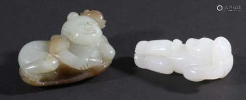CHINESE CELADON AND RUSSET JADE FIGURE, curled up on a lotus leaf and flower, length 5cm; together