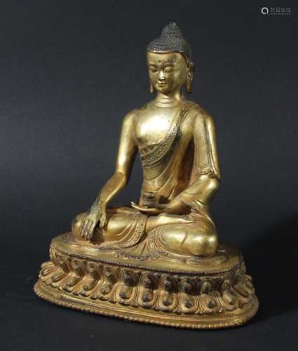 SINO-TIBETAN GILT BRONZE BUDDHA. probably 19th century, seated holding a vase, on a lotus base,