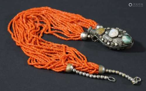 TIBETAN CORAL NECKLACE, the multiple strands of fine beads on a white metal snuff bottle mounted
