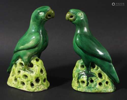 PAIR OF CHINESE MING STYLE PARROTS, probably 20th century, green glazed and standing on