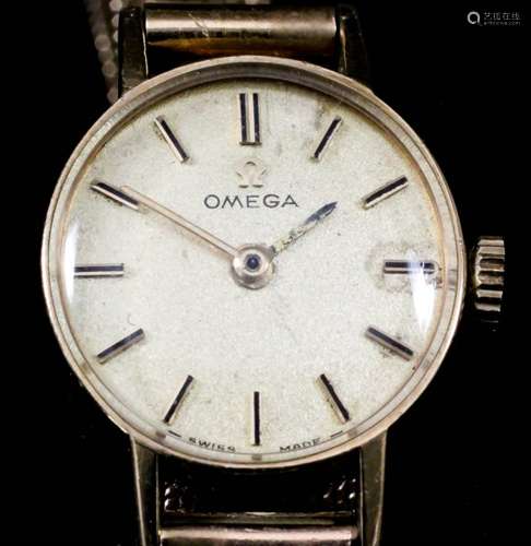 A lady's Omega 9ct gold cased wristwatch, the gold dial with gold and black baton numerals, 17mm