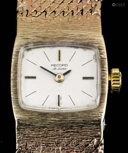 A lady's 9ct gold cased Record Deluxe manual wind wristwatch, the rectangular champagne dial with