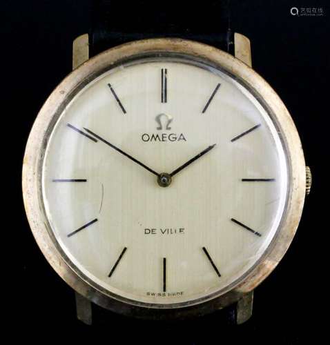 A gentleman's 9ct gold cased Omega De Ville manual wind wristwatch, the champagne dial with gold