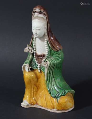 CHINESE SANCAI FIGURE OF GUANYIN, 19th century, seated holding a ruyi sceptre, height 20cm
