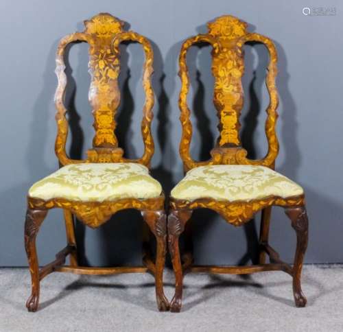 A pair of 19th Century Dutch walnut and marquetry high back dining chairs of 