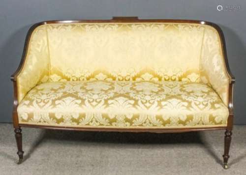 An early 20th Century mahogany framed three-seat tub shaped settee with moulded showwood frame,