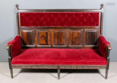 A late Victorian rosewood framed settle in the 