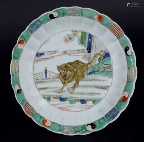 CHINESE FAMILLE VERTE CHRYSANTHEMUM SHAPED PLATE, perhaps Kangxi period, painted with a tiger in a