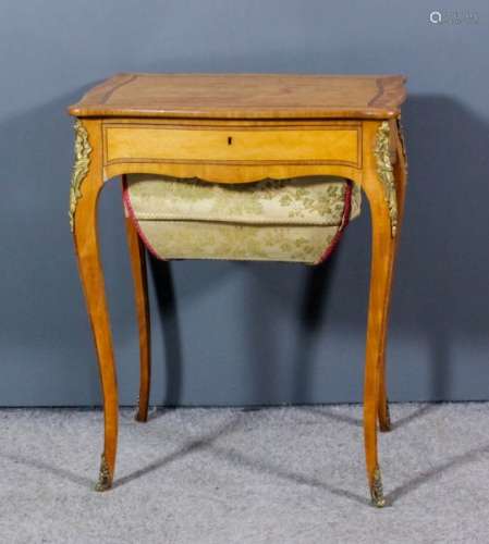 A 19th Century French satinwood rectangular worktable of slight serpentine outline, inlaid with