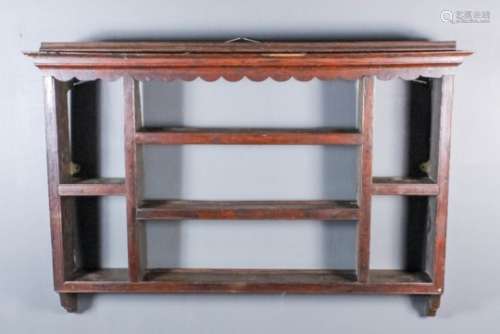 An 18th Century oak Delft rack with moulded cornice and wavy frieze, fitted seven shelves, 44.5ins