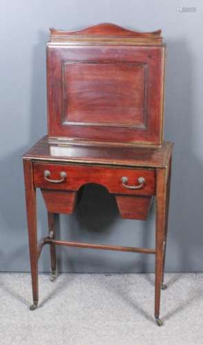 An Edwardian mahogany bureau/worktable, the superstructure with shaped top, panelled fall front