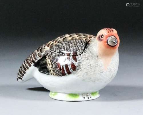 An 18th Century Meissen porcelain quail box and cover, 5.25ins x 2.875ins high (blue crossed