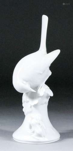 A 20th Century Meissen white glazed porcelain model of a bird perched on a rock and a frog, possibly