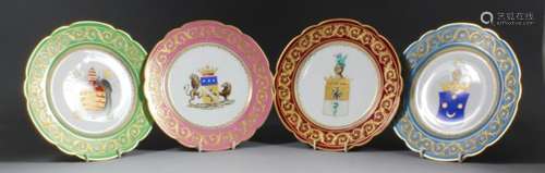 A set of four early 20th Century French porcelain cabinet plates, the centres decorated in enamel