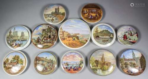 A collection of twelve 19th Century coloured pot lids, including 