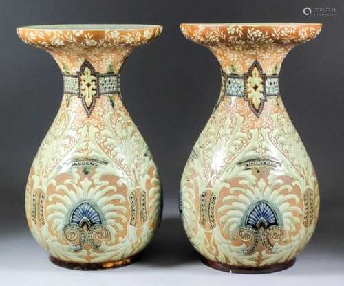 A pair of late 19th Century Doulton Lambeth stoneware vases of flared form designed by Frank Butler,