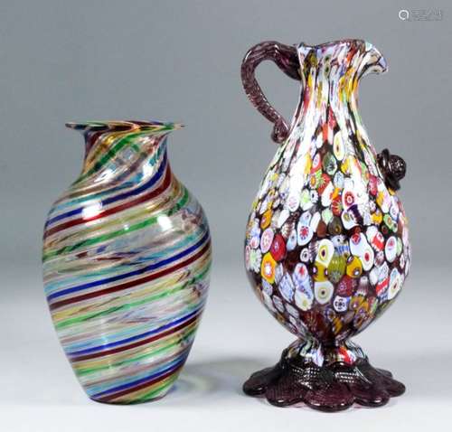 An Italian Murano glass ewer, the body with multicoloured cane decoration, mauve patterned glass