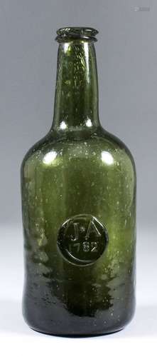 A late 18th Century green glass sealed wine bottle of cylindrical form, of olive green tint with