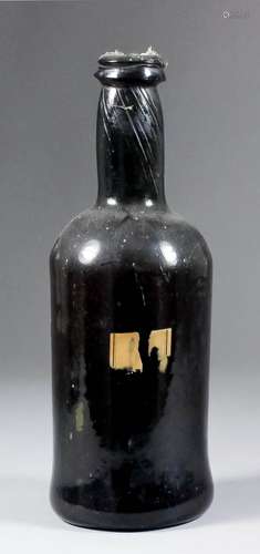 A late 18th Century olive green glass wine bottle of cylindrical form with moulded string rim, 10.