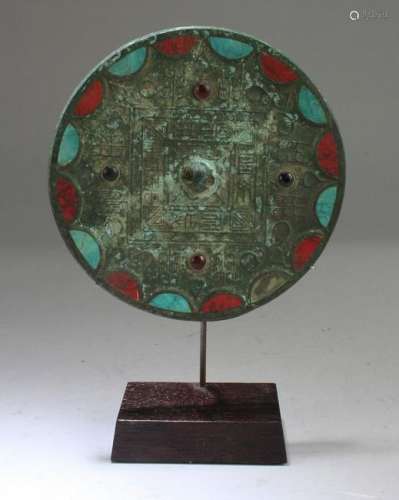 A Bronze Mirror with Red and Blue Turquoise Inlay