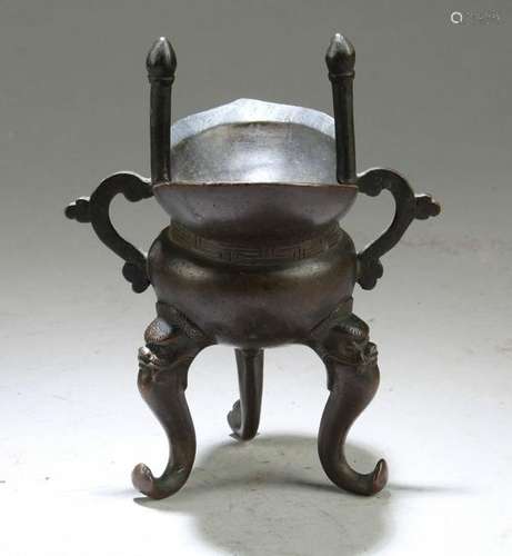 A Bronze Tripod Vessel