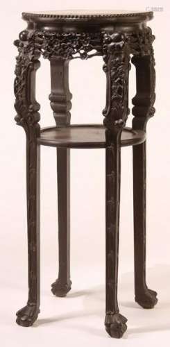 A CHINESE EXPORT CARVED HARDWOOD AND MARBLE STAND,
