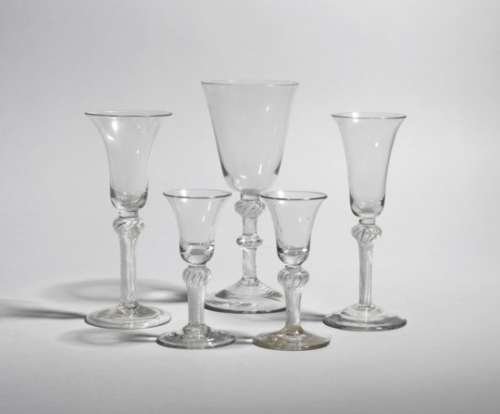 Five wine glasses c.1750-70, four in different sizes with bell bowls raised on dense airtwist stems,