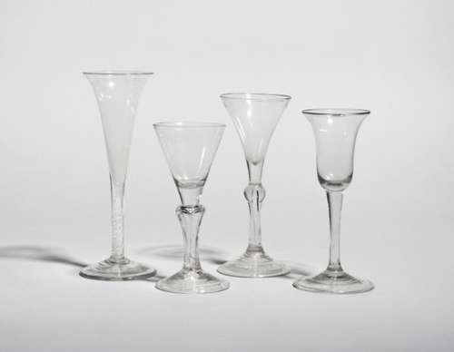 Four Continental wine glasses, 18th century, one with a rounded funnel bowl raised on a six-sided