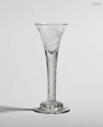 A wine glass of Jacobite type c.1760, the drawn trumpet bowl engraved with a six petal rose spray,