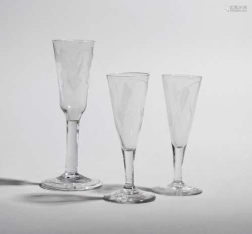 Three ale glasses c.1760, two with drawn trumpet bowls engraved with a single barley ear and a spray