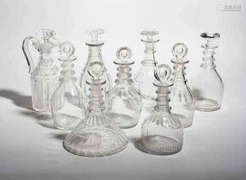 Eight glass decanters and stoppers, 19th century, most of Prussian form and applied with three