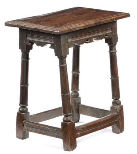 A Charles I oak joint stool, the seat with a triple moulded edge, above moulded and twin bicuspid