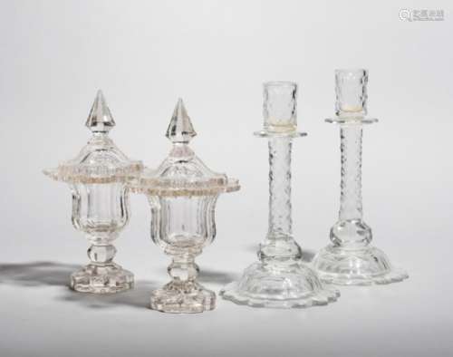 A pair of cut glass candlesticks, late 18th/early 19th century, cut with small diamond facets and