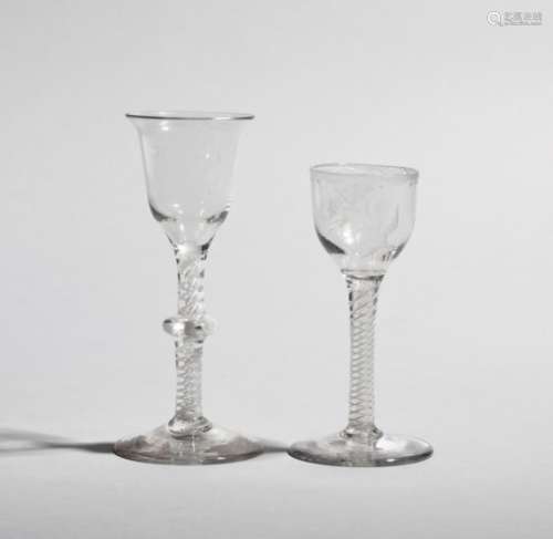 Two wine glasses c.1760, one with a slight ogee bowl with everted rim raised on a knopped opaque