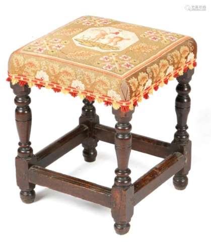 A Charles II upholstered oak stool, later covered with 19th century needlework depicting a horse and