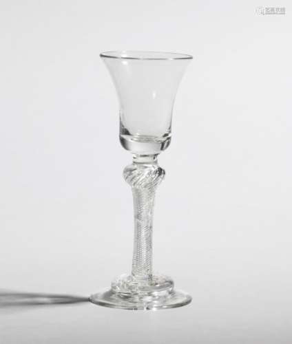 A wine glass c.1760, the bell bowl raised on a dense airtwist stem above a domed foot, 15.8cm.
