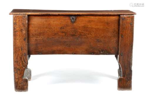 A Welsh Borders oak 'clamp front' chest, the hinged lid revealing a vacant interior, with four