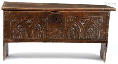 An Elizabethan oak boarded coffer, the lid with a moulded edge, with later hinges, the front
