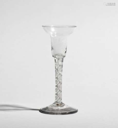 A pan-topped wine glass c.1765, the narrow bowl rising to a broad rim, raised on a double series