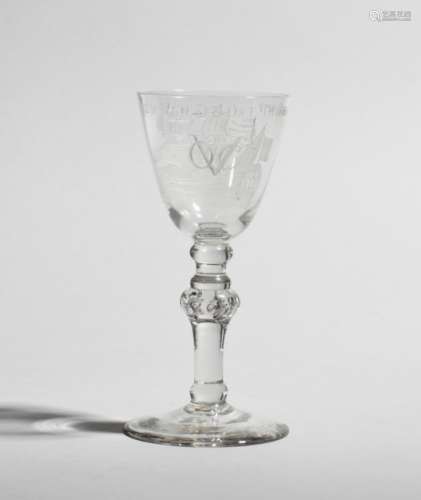 A Dutch-engraved 'VOC' goblet c.1750, the generous round funnel bowl engraved with a three-masted