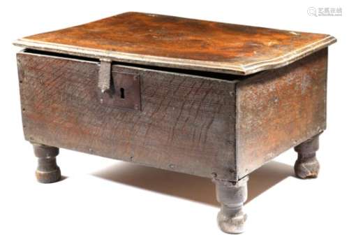 An oak box, the elm lid with a moulded edge, on turned feet, 17th century and later, 25cm high, 44.