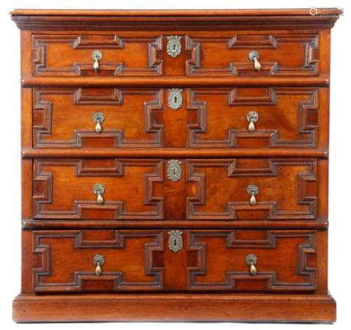 A William and Mary and later walnut chest, the top with a moulded edge, above four long geometric